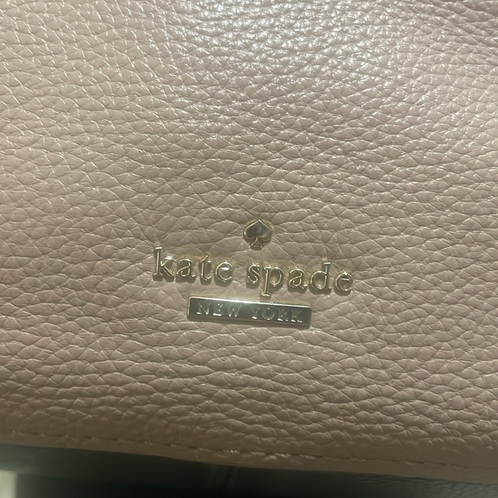 Pre-loved Kate Spade shoulder bag. Colors are fawn and black with gold accents. - Picture 3 of 9